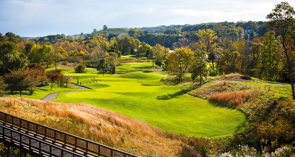 Panoramic view of a lush green golf course at Great River Golf Club. Smooth