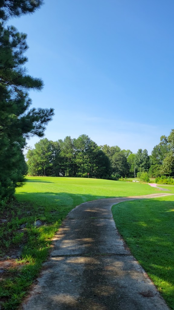 Panoramic view of a lush green golf course at Green Briar Golf. Smooth