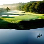 Panoramic view of a lush green golf course at Green Harbor Golf Club. Smooth