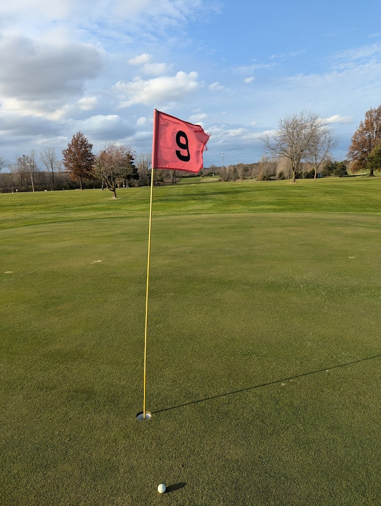 Panoramic view of a lush green golf course at Green Valley Golf Club. Smooth