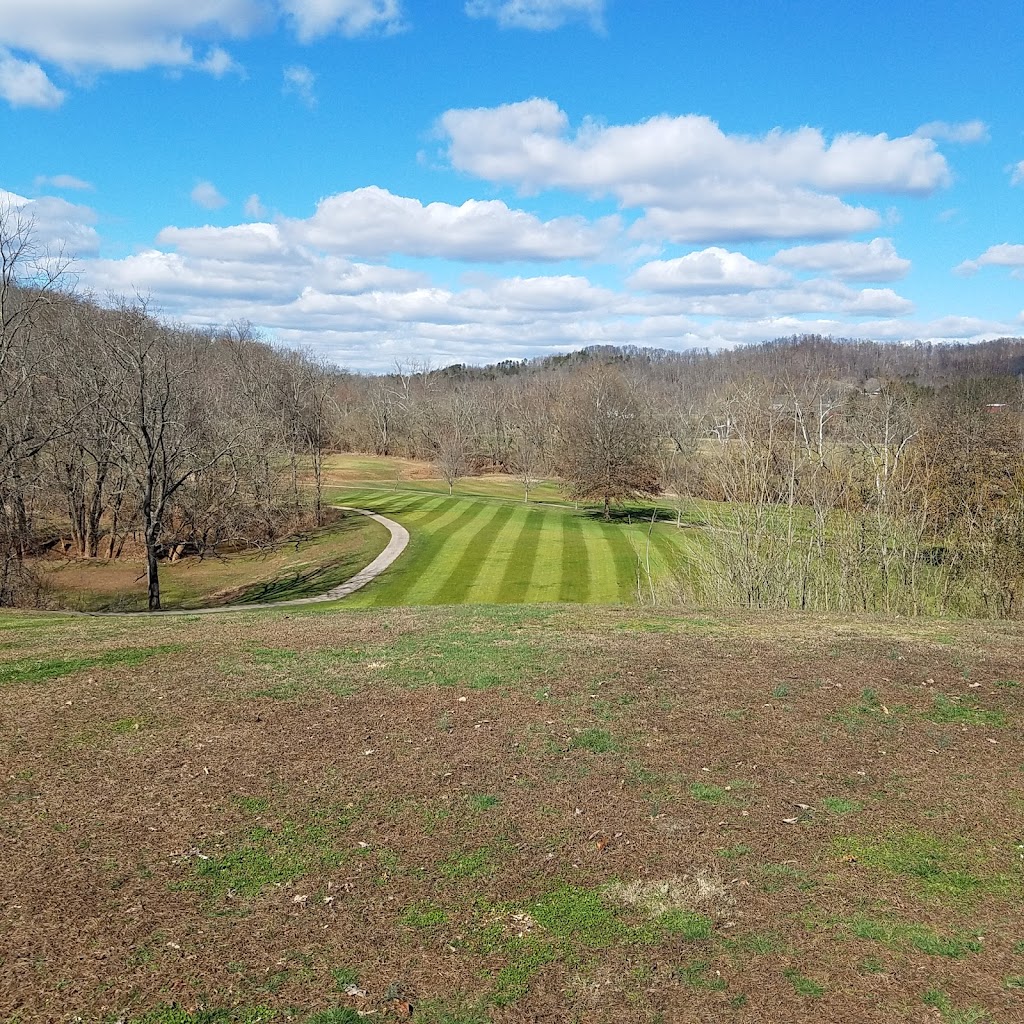 Panoramic view of a lush green golf course at Greenhills Golf Course. Smooth