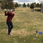 green grass with the flag in the hole.