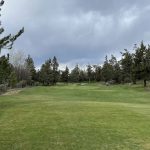 Panoramic view of a lush green golf course at Greens At Redmond. Smooth