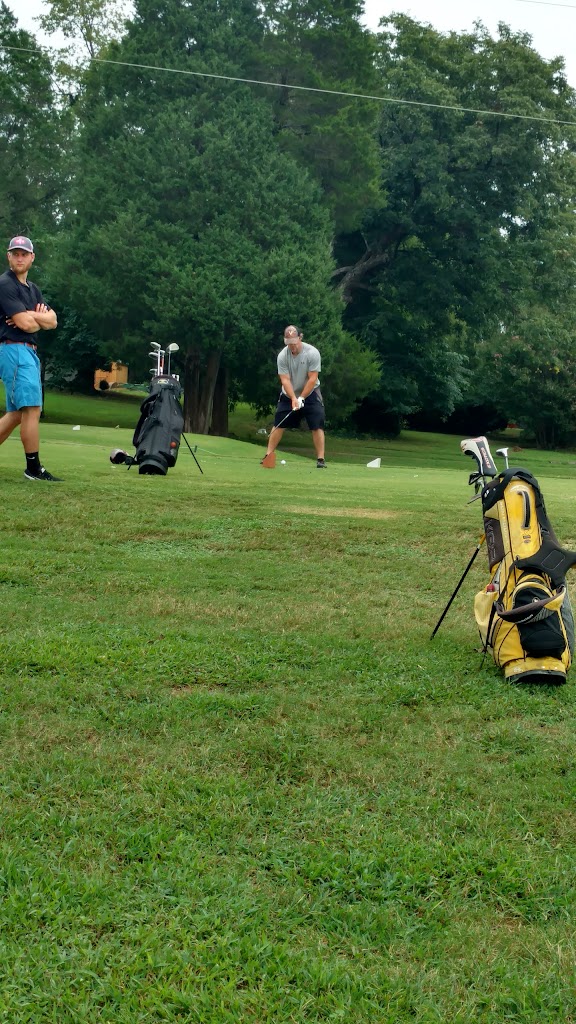 Panoramic view of a lush green golf course at Greens Folly Golf Course. Smooth