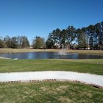 Panoramic view of a lush green golf course at Greystone Country Club. Smooth