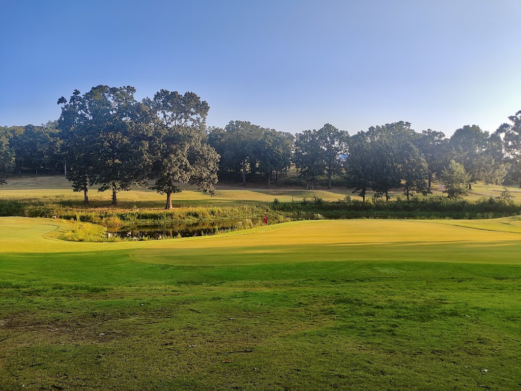 Panoramic view of a lush green golf course at Greystone Country Club. Smooth
