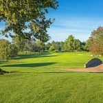 Panoramic view of a lush green golf course at Griffin Gate Golf Club. Smooth