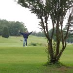 green grass with the flag in the hole.