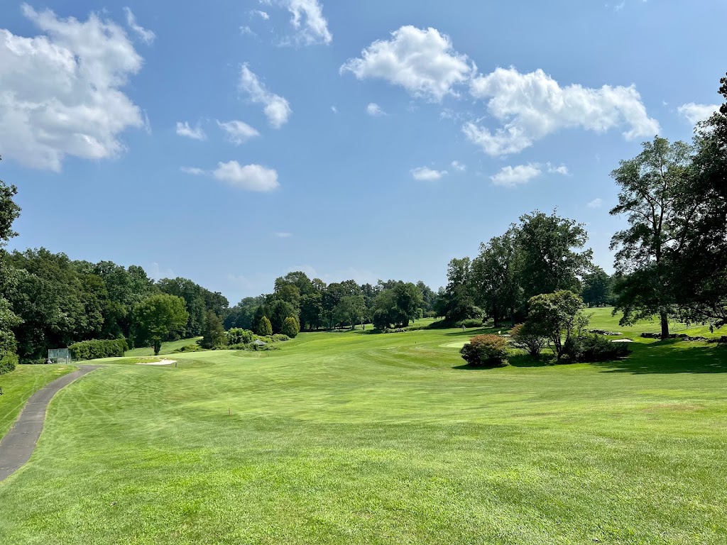 Panoramic view of a lush green golf course at Griffith E Harris Golf Course. Smooth