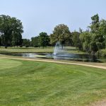 Panoramic view of a lush green golf course at Gross National Golf Club. Smooth