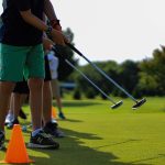 green grass with the flag in the hole.