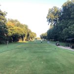 Panoramic view of a lush green golf course at Grover C. Keeton Golf Course. Smooth