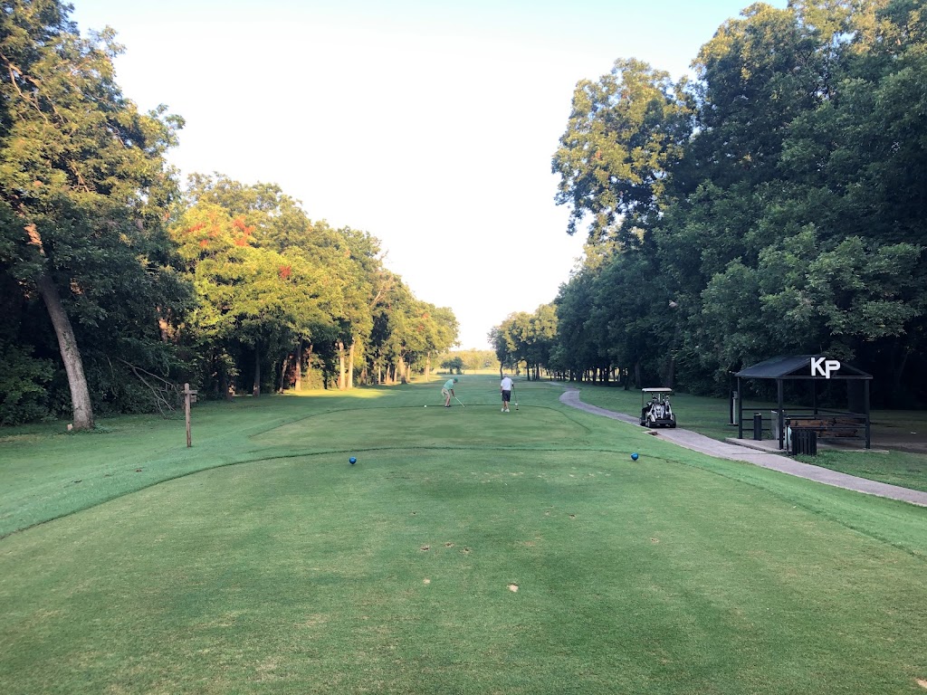 Panoramic view of a lush green golf course at Grover C. Keeton Golf Course. Smooth