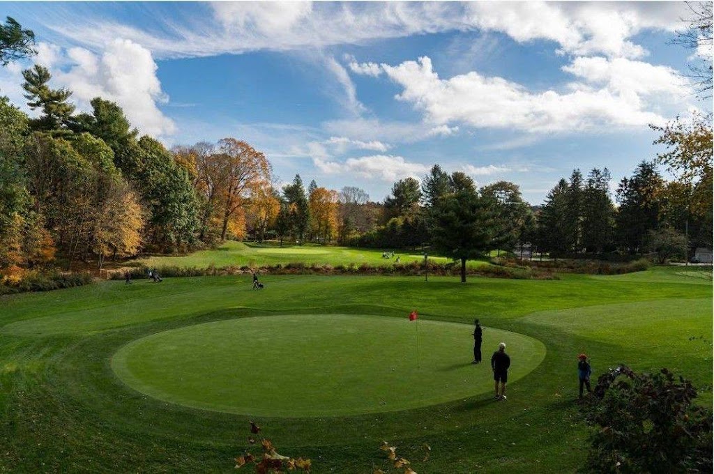Panoramic view of a lush green golf course at Guilford Lakes Golf Course. Smooth