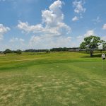 Panoramic view of a lush green golf course at Gulf Links Golf Course. Smooth