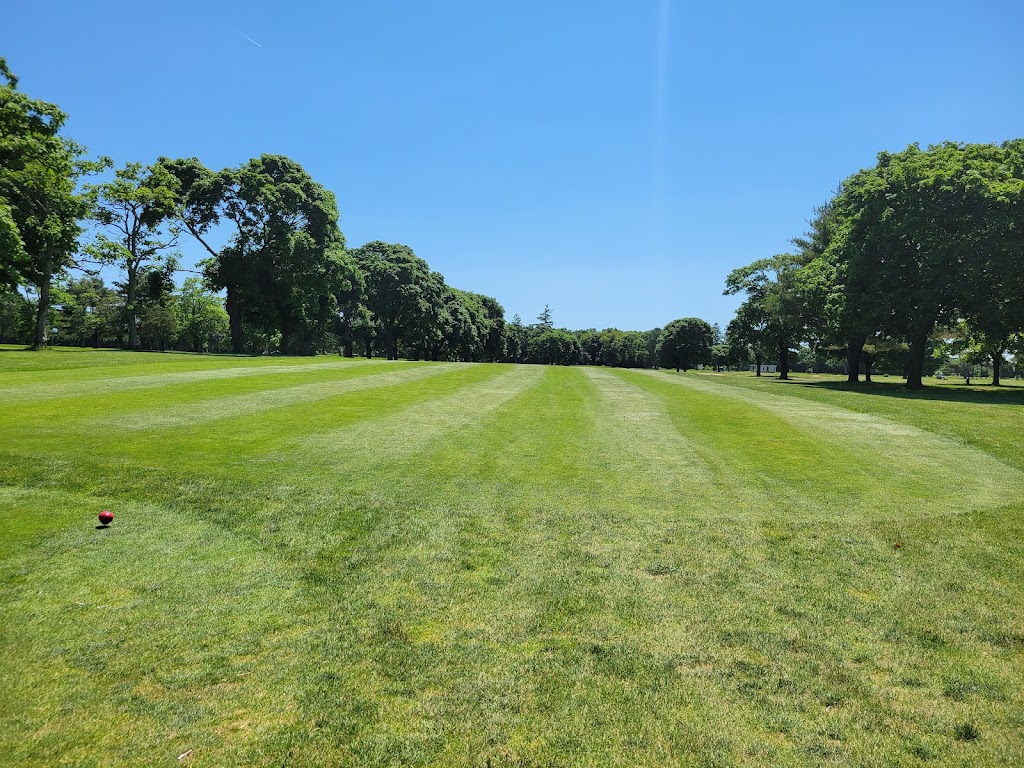 Panoramic view of a lush green golf course at Gull Haven Golf Course. Smooth
