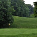 Panoramic view of a lush green golf course at Gunpowder Golf Course. Smooth