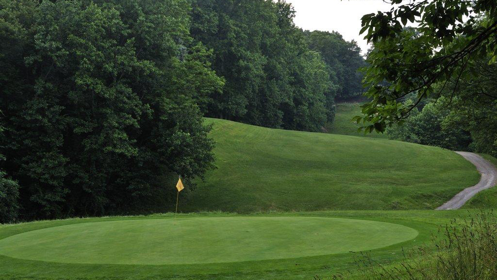 Panoramic view of a lush green golf course at Gunpowder Golf Course. Smooth