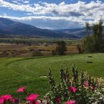 Panoramic view of a lush green golf course at Gypsum Creek Golf Course. Smooth