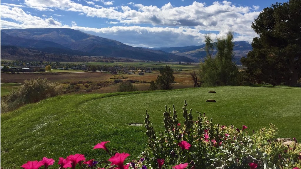 Panoramic view of a lush green golf course at Gypsum Creek Golf Course. Smooth