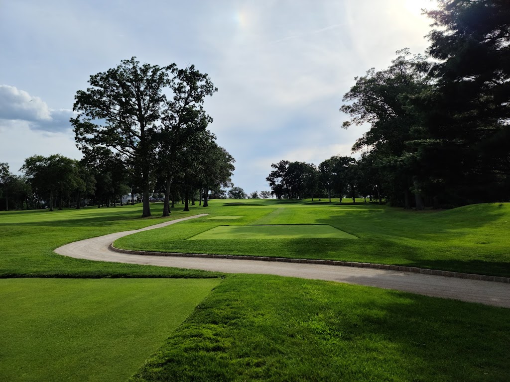 Panoramic view of a lush green golf course at Hackensack Golf Club. Smooth