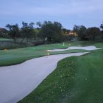 green grass with the flag in the hole.