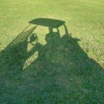 green grass with the flag in the hole.