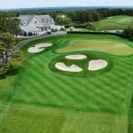 Panoramic view of a lush green golf course at Hampton Hills Golf & Country Club. Smooth