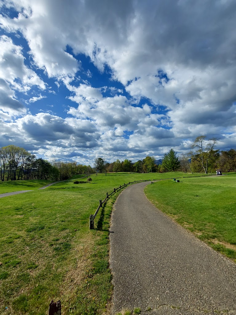 Panoramic view of a lush green golf course at Hanging Rock Golf Club. Smooth