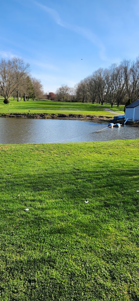 Panoramic view of a lush green golf course at Hanover Golf Club. Smooth