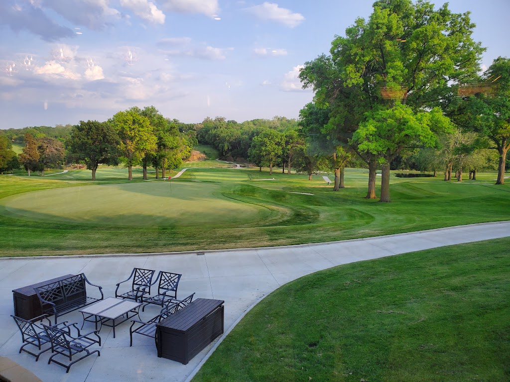 Panoramic view of a lush green golf course at Happy Hollow Club. Smooth