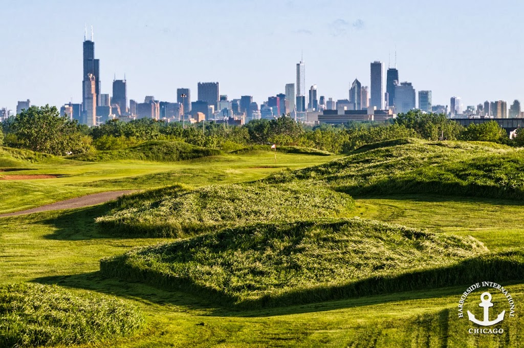 Panoramic view of a lush green golf course at Harborside International Golf Center. Smooth