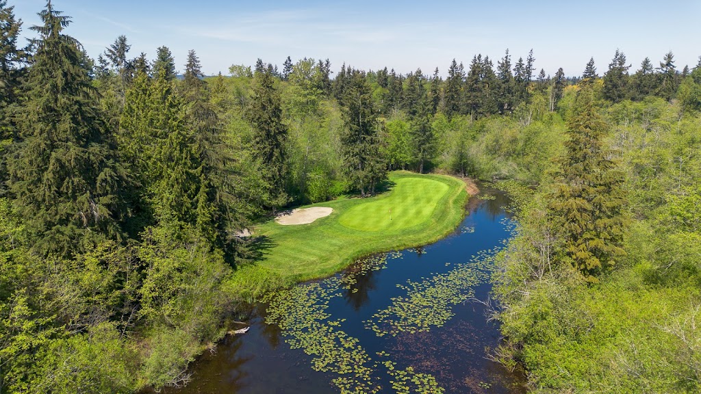 Panoramic view of a lush green golf course at Harbour Pointe Golf Club. Smooth