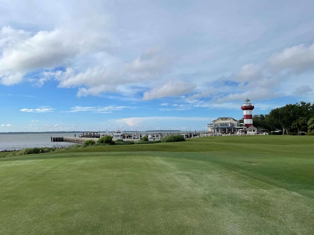 Panoramic view of a lush green golf course at Harbour Town Golf Links. Smooth