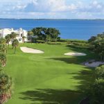 Panoramic view of a lush green golf course at Harbourside Golf Course. Smooth