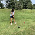 green grass with the flag in the hole.
