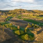 Panoramic view of a lush green golf course at Hart Ranch Golf Club. Smooth