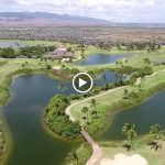 Panoramic view of a lush green golf course at Hawaii Golf Club Rentals. Smooth