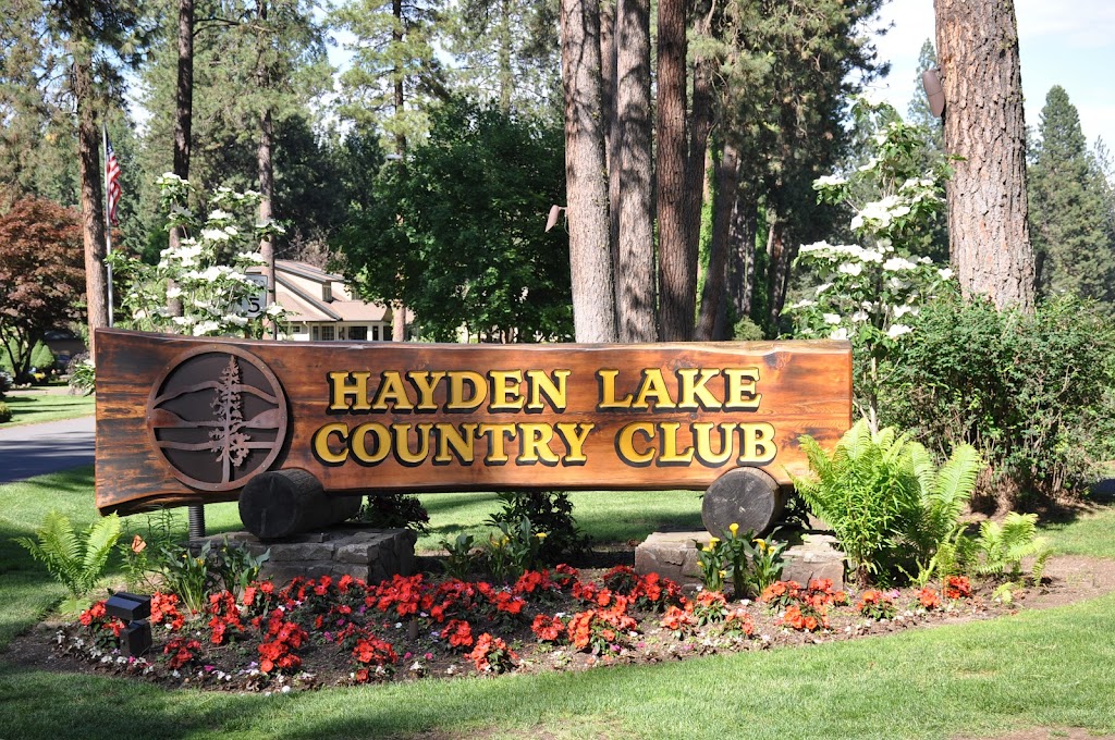 Panoramic view of a lush green golf course at Hayden Lake Country Club. Smooth