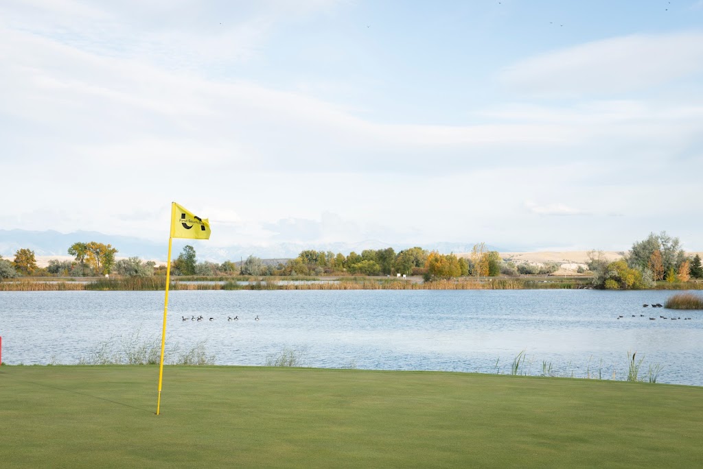 Panoramic view of a lush green golf course at Headwaters Public Golf Course. Smooth