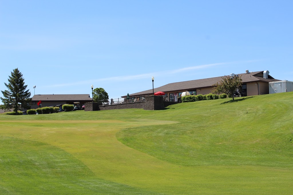 Panoramic view of a lush green golf course at Heart River Golf Course. Smooth