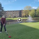green grass with the flag in the hole.