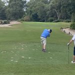 Panoramic view of a lush green golf course at Heritage Club. Smooth