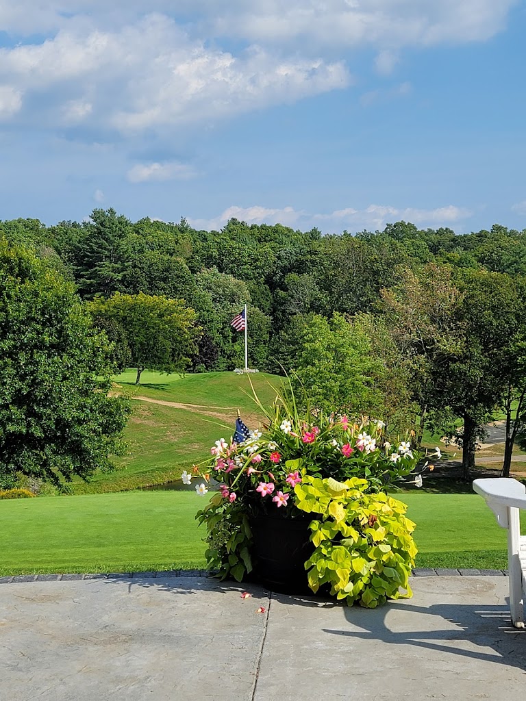 Panoramic view of a lush green golf course at Heritage Country Club. Smooth