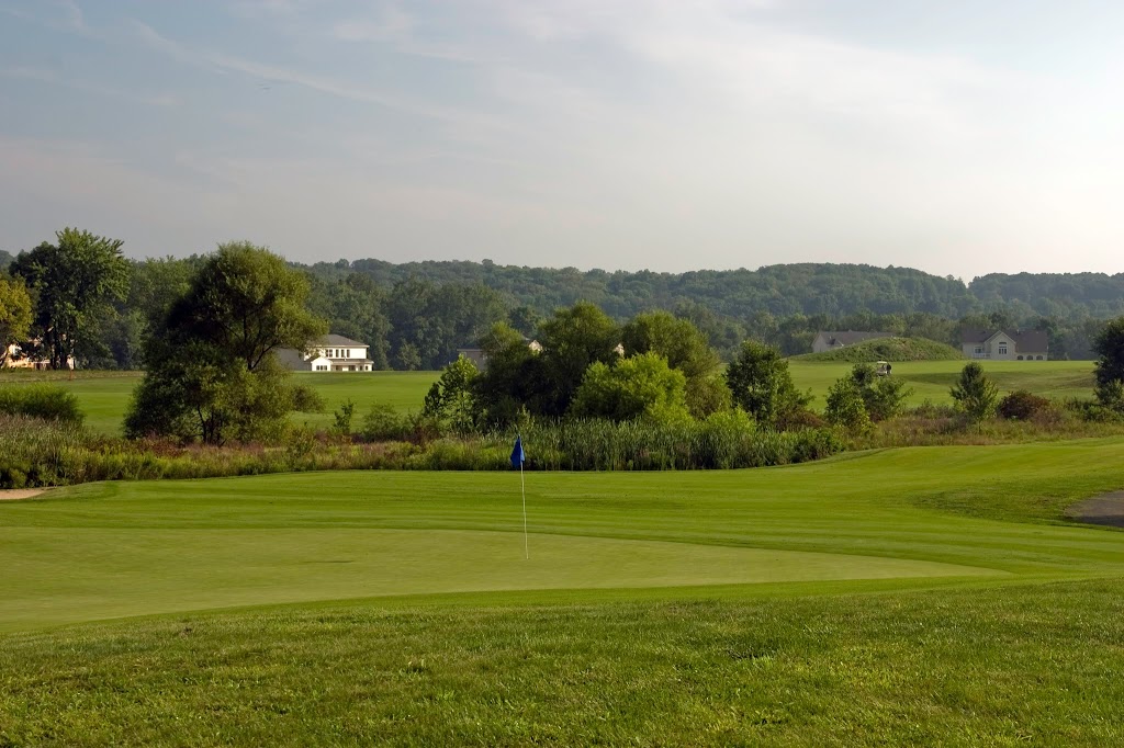 Panoramic view of a lush green golf course at Heritage Creek Golf Club. Smooth