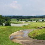 Panoramic view of a lush green golf course at Heritage Hill Golf Club. Smooth