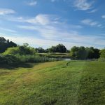 Panoramic view of a lush green golf course at Heritage Links Golf Club. Smooth