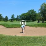 green grass with the flag in the hole.