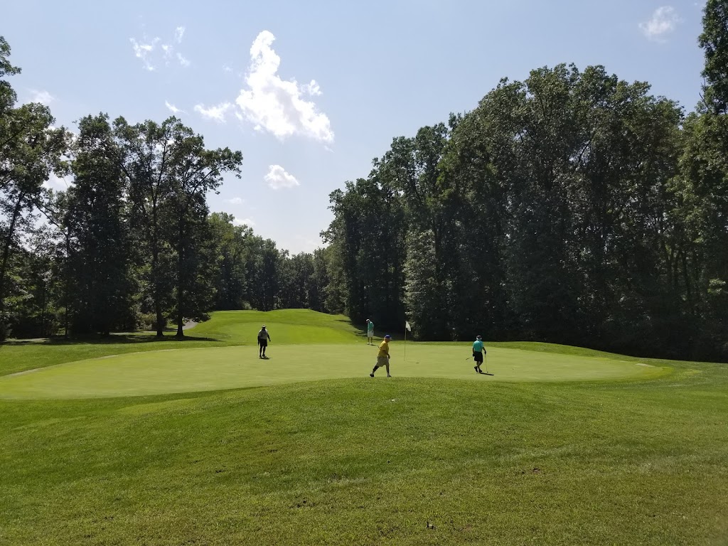 Panoramic view of a lush green golf course at Heritage Oaks Golf Course. Smooth