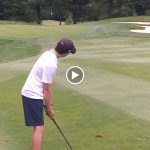 green grass with the flag in the hole.